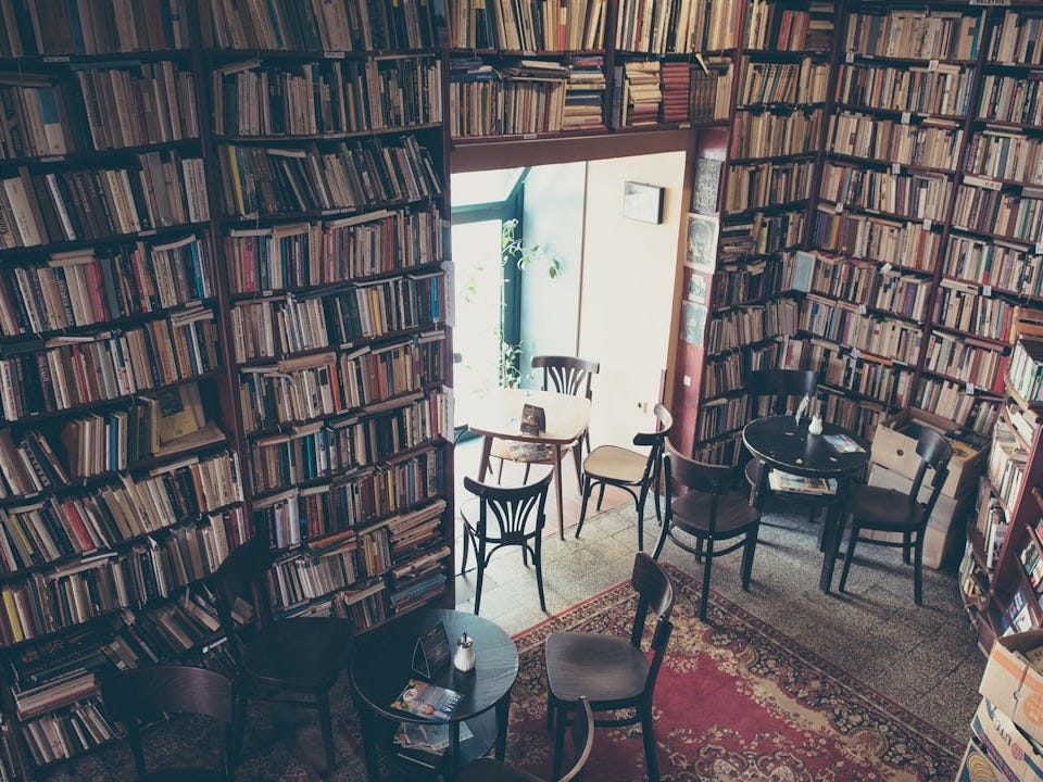 brown wooden shelf near white wall brown wooden shelf near white wall