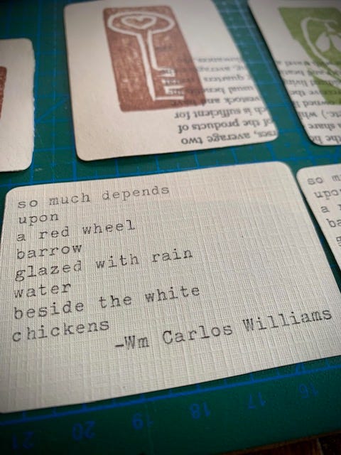 Two photos of small cards with poems by emily dickinson and william carlos williams typed on them