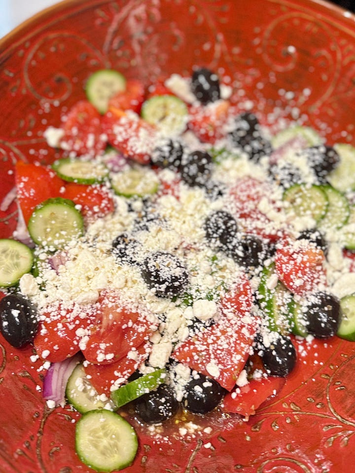 L: Bowl of red onions, cucumbers, black olives and tomatoes, R: bowl of cucumbers, black olives, red onions, tomatoes and crumbled feta cheese