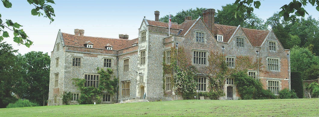 The exterior of Chawton House. A grey stone Elizabethan great house. The exterior of Chawton House. A grey stone Elizabethan great house.