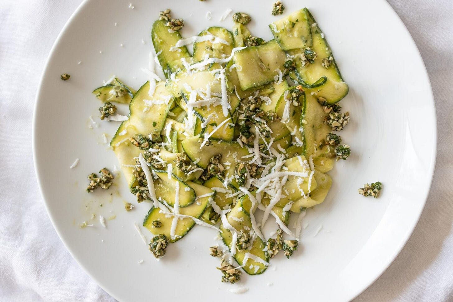 zucchini salad with avocado, pepita parsley gremolata