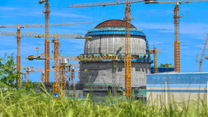 Cranes stand at the construction site of the second phase of Changjiang Nuclear Power Plant, invested by state-owned China National Nuclear Corporation (CNNC) and China Huaneng Group, on June 28, 2023 in Changjiang Li Autonomous County, Hainan Province of China.