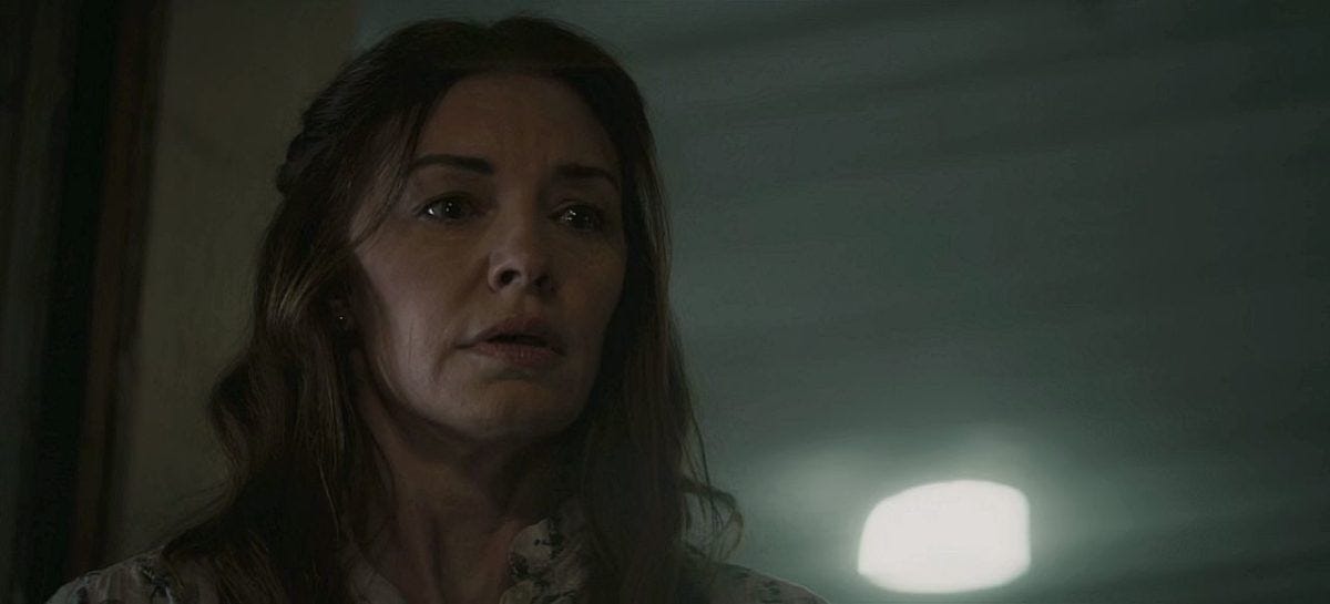 Millie Winchester looking scared with Kyle's bleeding out body in her garage. Millie Winchester looking scared with Kyle's bleeding out body in her garage.