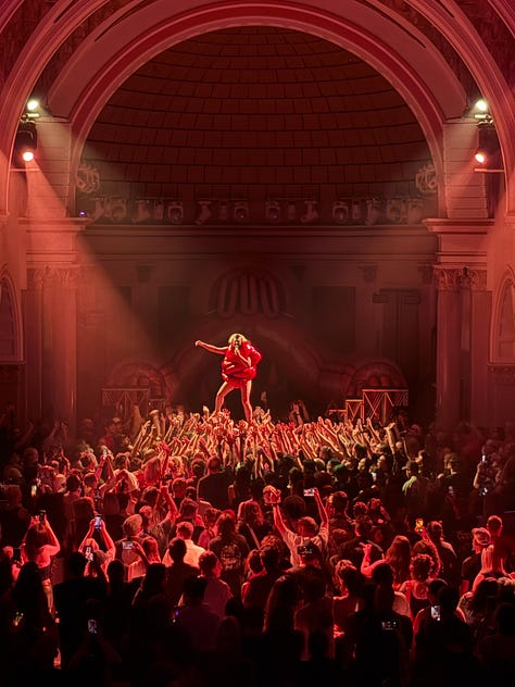 a crowd holding up a woman at La Rosa in Tucson