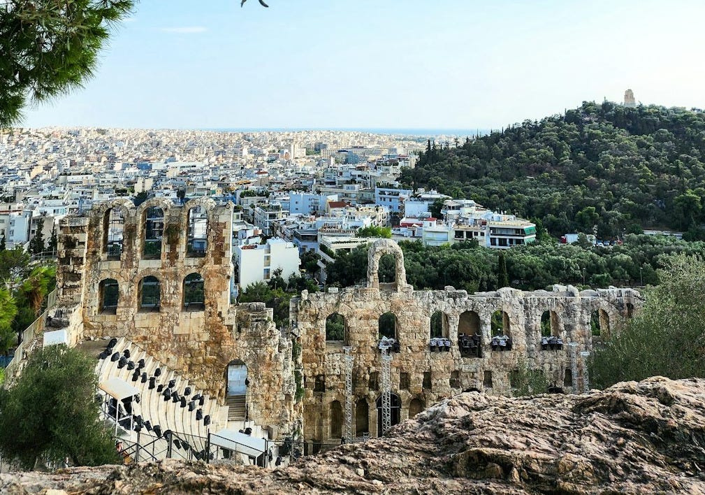 a view of the city from the top of a hill