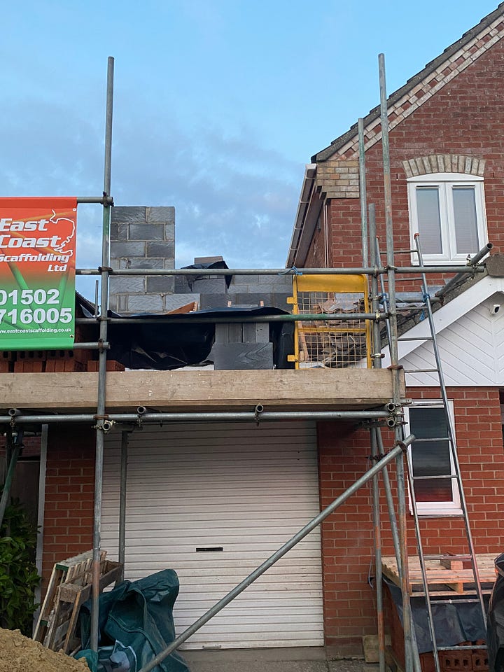 Before and after of the extension. The before photo shows the garage with the roof tiles off and scaffolding and the after photo shows the roof completely removed and the block work which has been started
