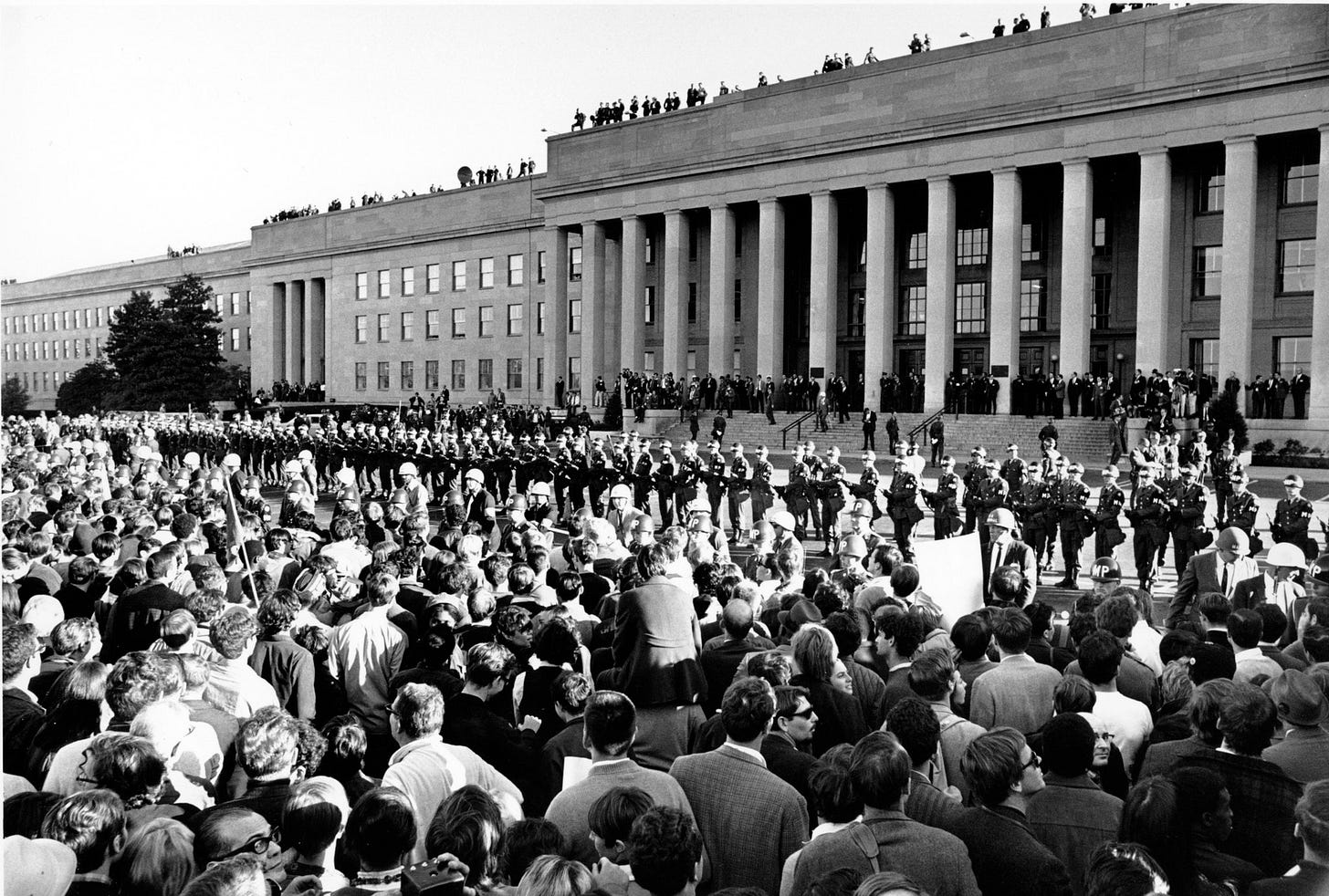 A crowd of people outside a building

AI-generated content may be incorrect.