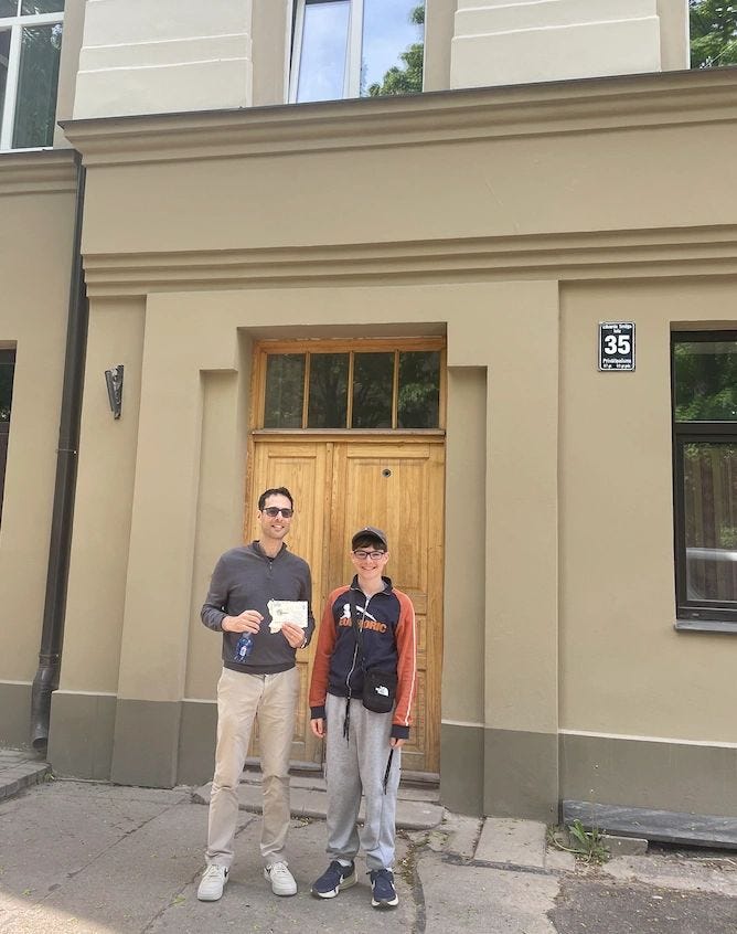 Outside the apartment building where my late cousin Haja lived in Riga (May 2026). The last close Sandler relative to remain in Latvia.