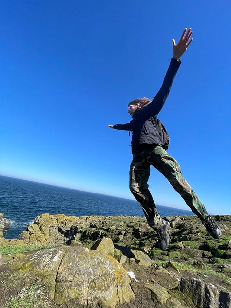 Jumping with Scottish scenery