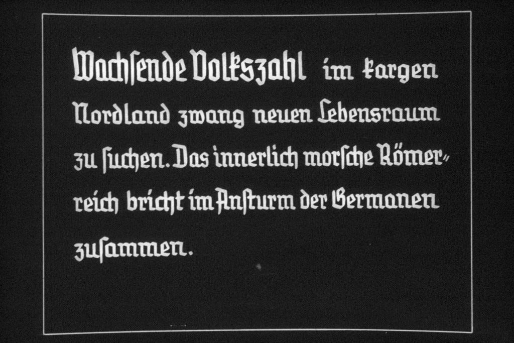 Black slide with white stylized text in German.