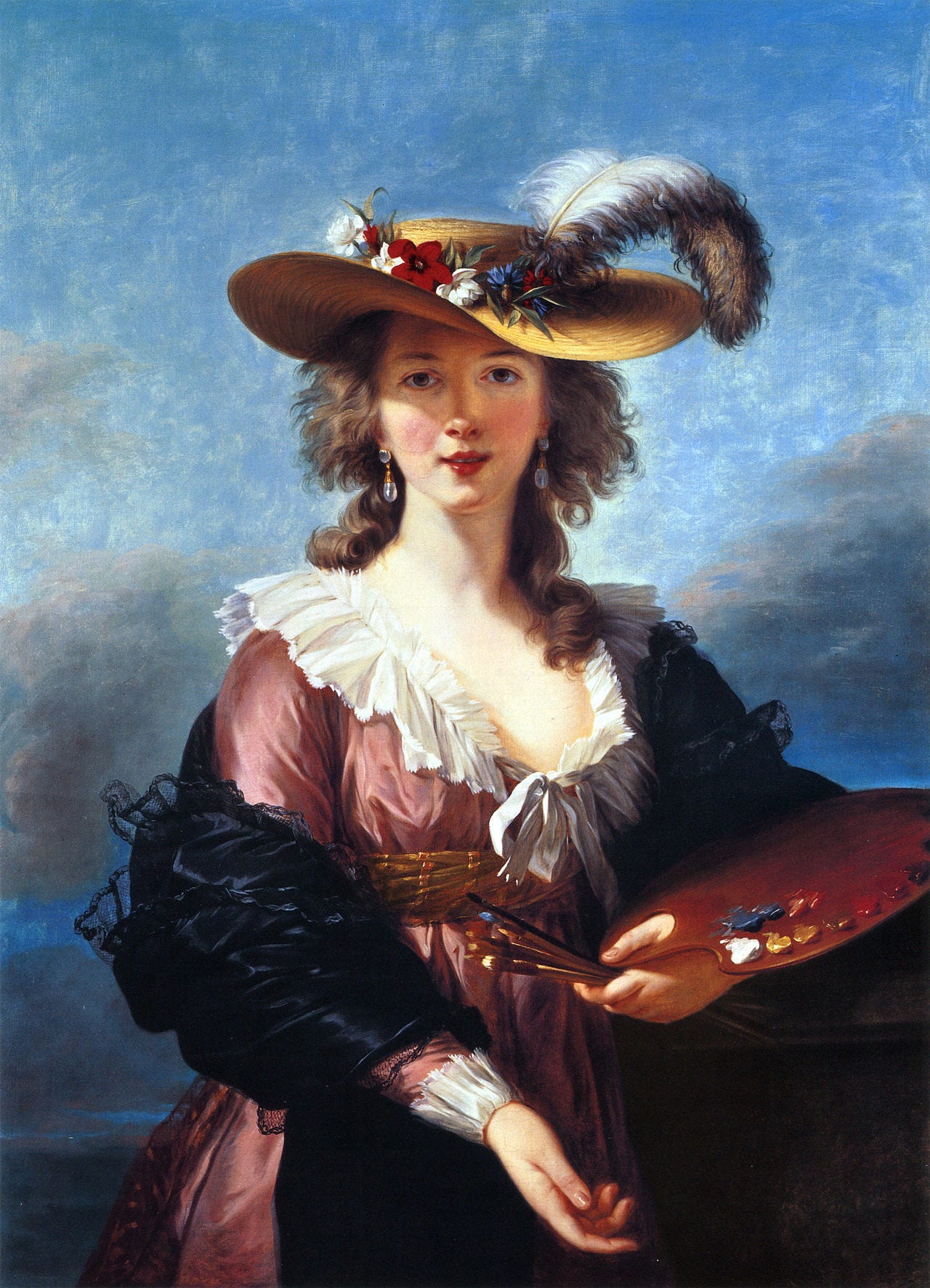 Woman painter smiling in a feathered straw hat Woman painter smiling in a feathered straw hat