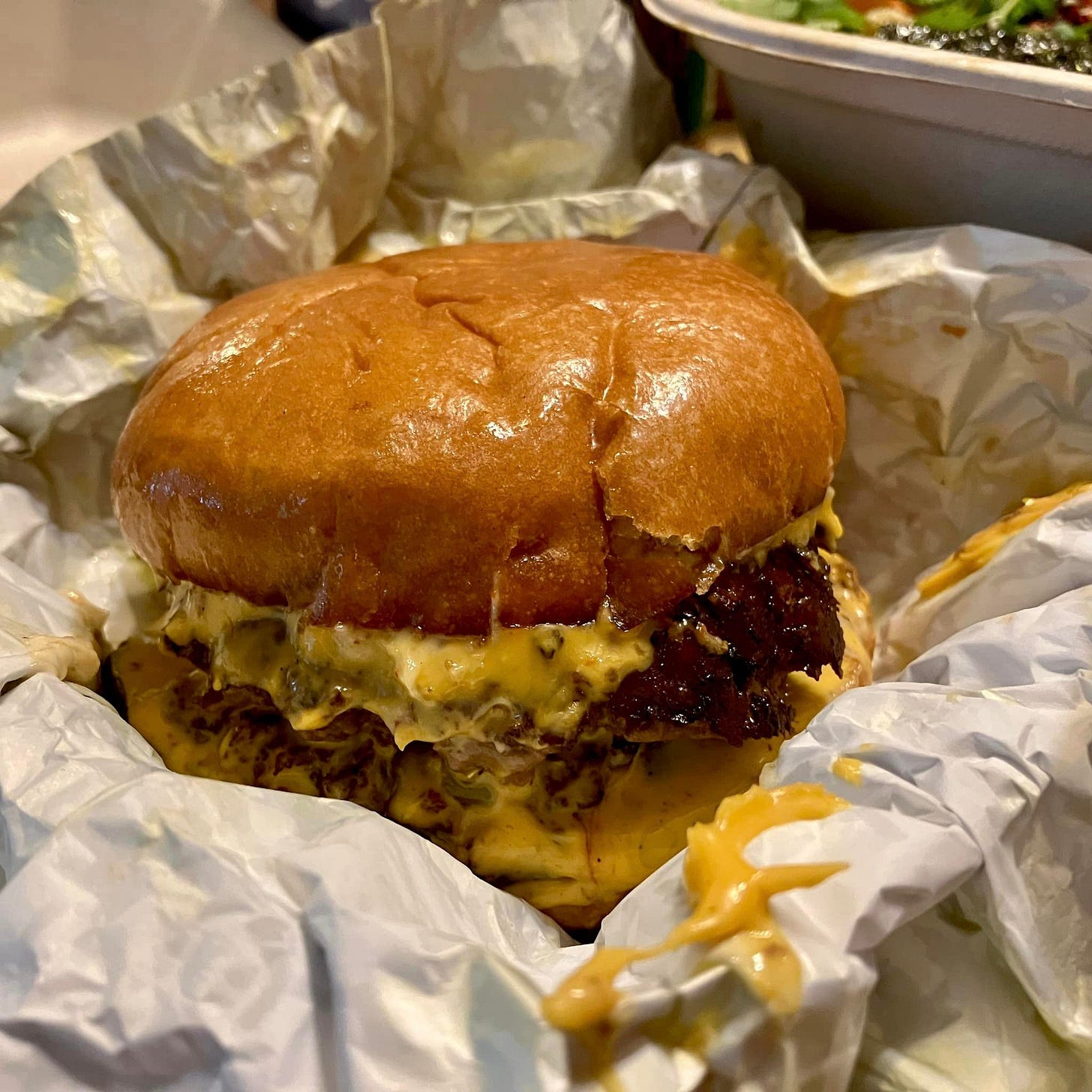 May be an image of chicken sandwich and burger