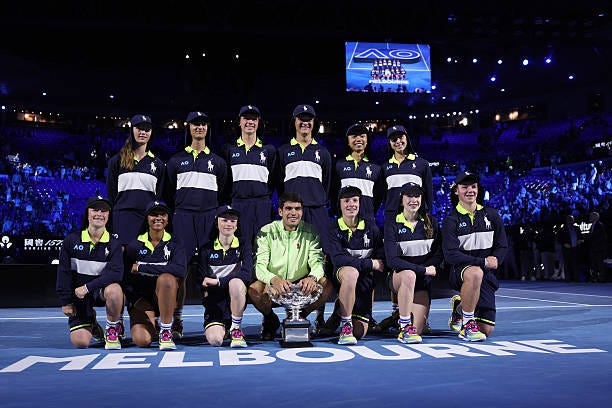 Spain's Carlos Alcaraz poses with ball kids after defeating Serbia's Novak Djokovic in the men's singles final on Day 15 of the Australian Open... Spain's Carlos Alcaraz poses with ball kids after defeating Serbia's Novak Djokovic in the men's singles final on Day 15 of the Australian Open...
