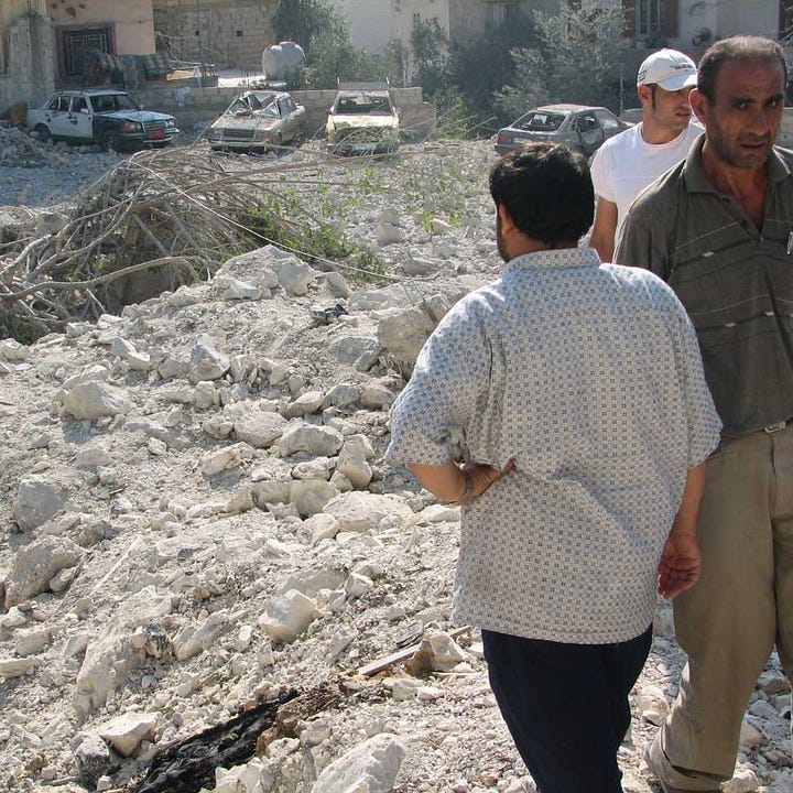 Palestinian residents assess damage after Israeli strike in Ain-al Hilweh shortly before ceasefire