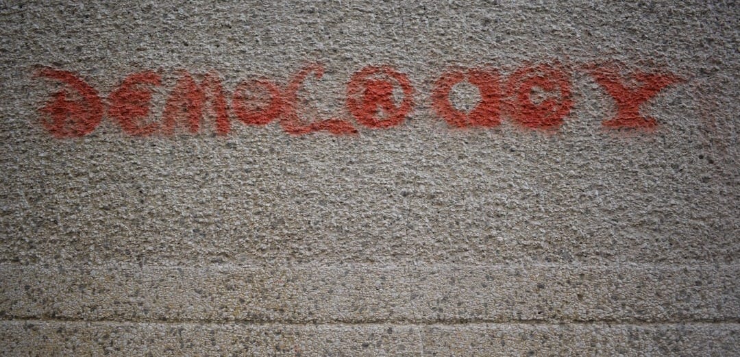 red paint on white pavement red paint on white pavement