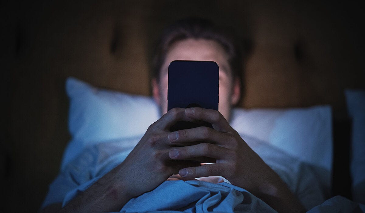 someone scrolling in bed