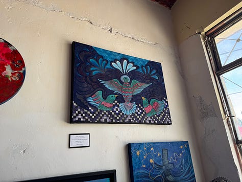 A selection of paintings and mixed media art.