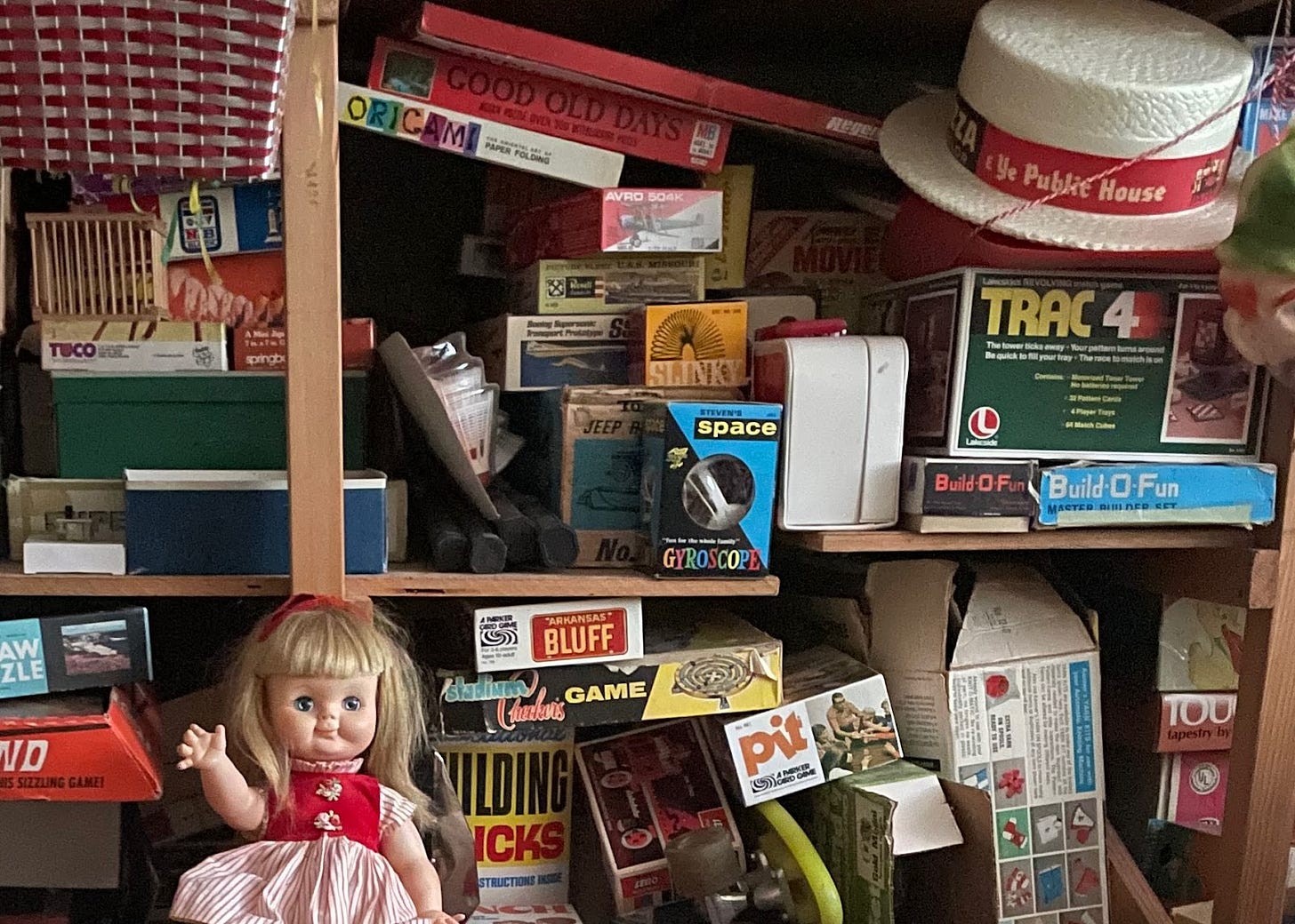 Toys on the shelf in a basement Toys on the shelf in a basement
