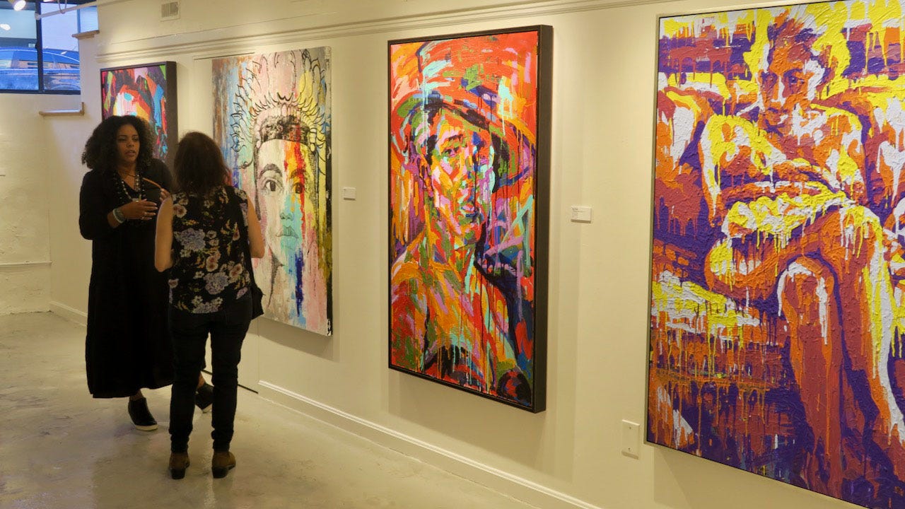 A couple of women looking at art

Description automatically generated with low confidence