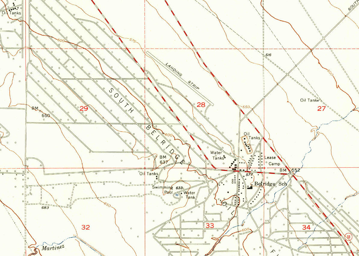 Topographic quadrangle map with hollow black circles marking oil wells. Topographic quadrangle map with hollow black circles marking oil wells.