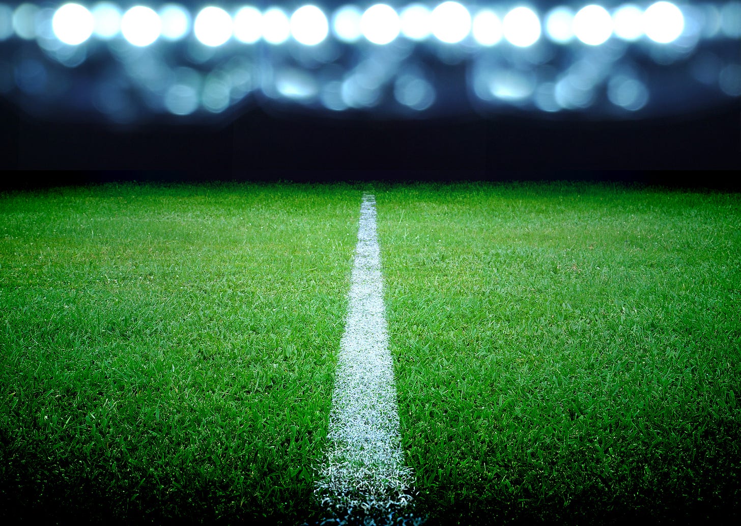 Close up of white line in centre of football pitch