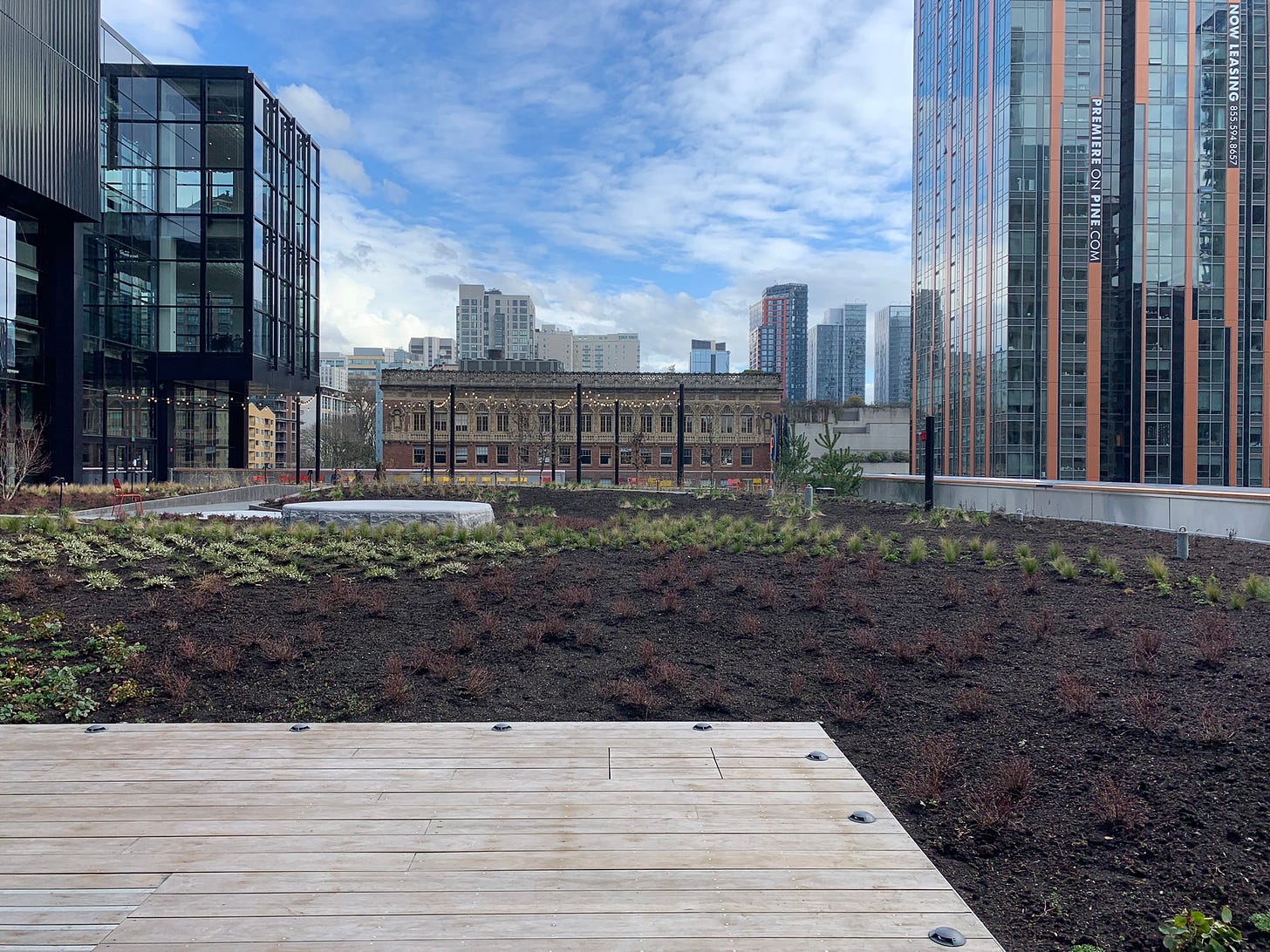 View of greenery and buildings from outdoor terrace in Seattle View of greenery and buildings from outdoor terrace in Seattle