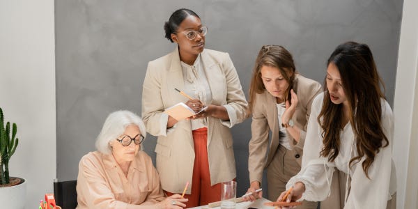 Diverse group of women collaborating around a table