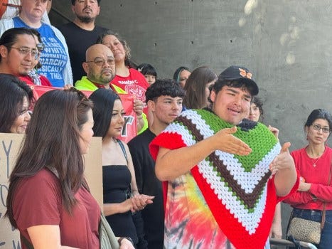 18-year-old deaf activist Anthony Paredes is seen with Los Angeles educators and organizers at a Saturday rally decrying federal immigration enforcement. The rally was held in front of LAUSD headquarters in downtown Los Angeles. Paredes said DHS officials took him into custody at a Jan. 24 protest for not complying with their orders. Photo by Joshua Silla
