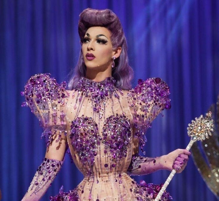 Violet Chachki with the prize sceptre