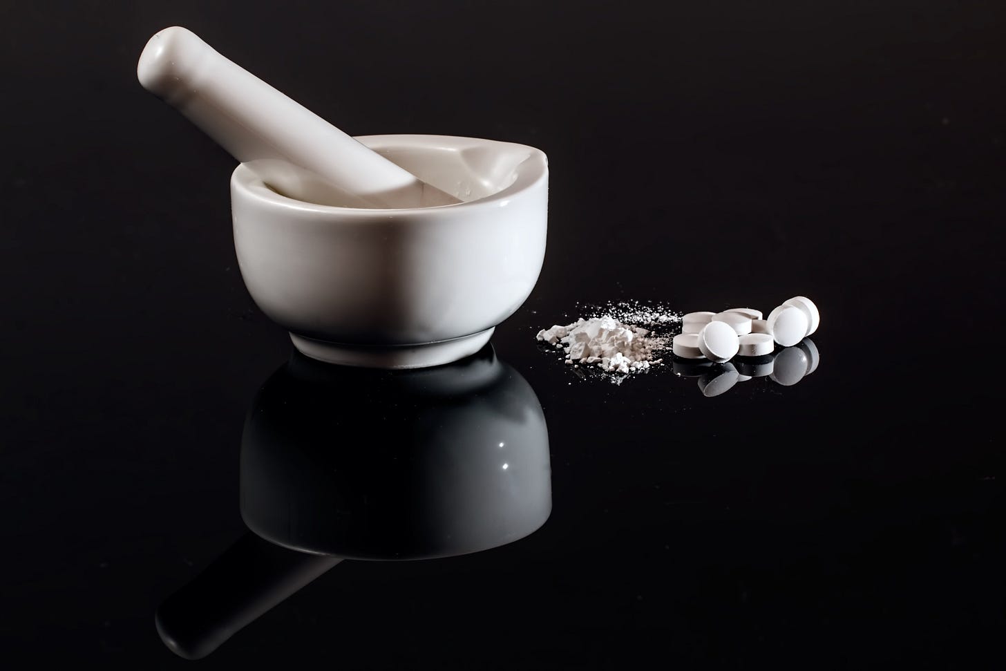 Mortar and pestle on black background