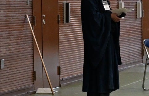 A group of people sitting on the floor

AI-generated content may be incorrect.