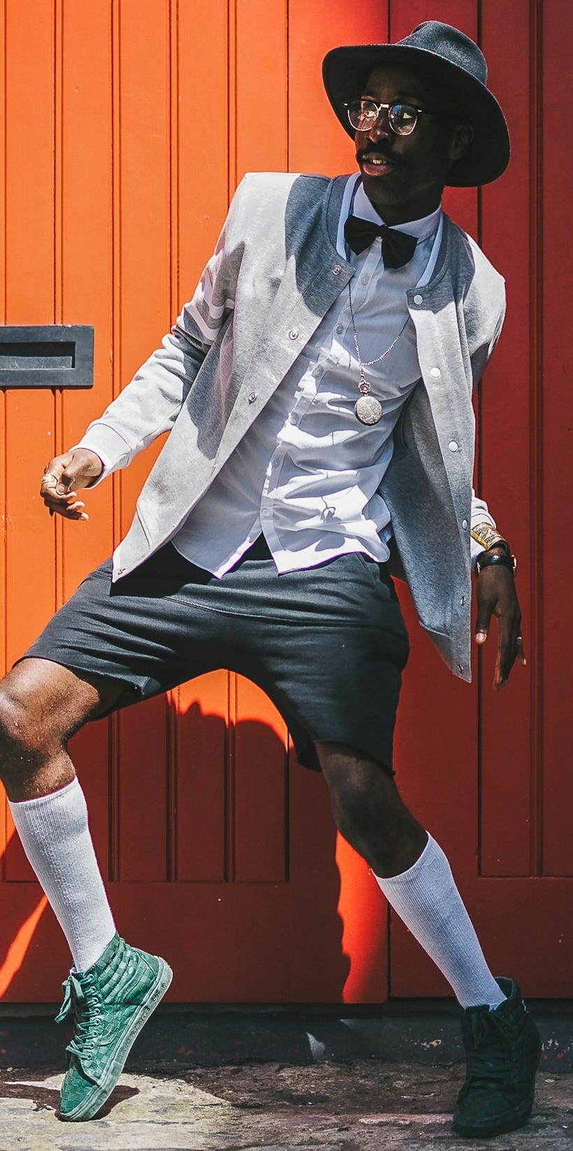 man doing tip-toe stunt during daytime