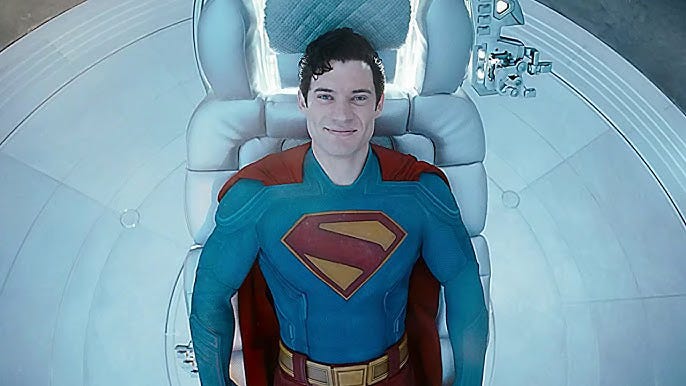 Superman lays back in a chair looking up at the ceiling