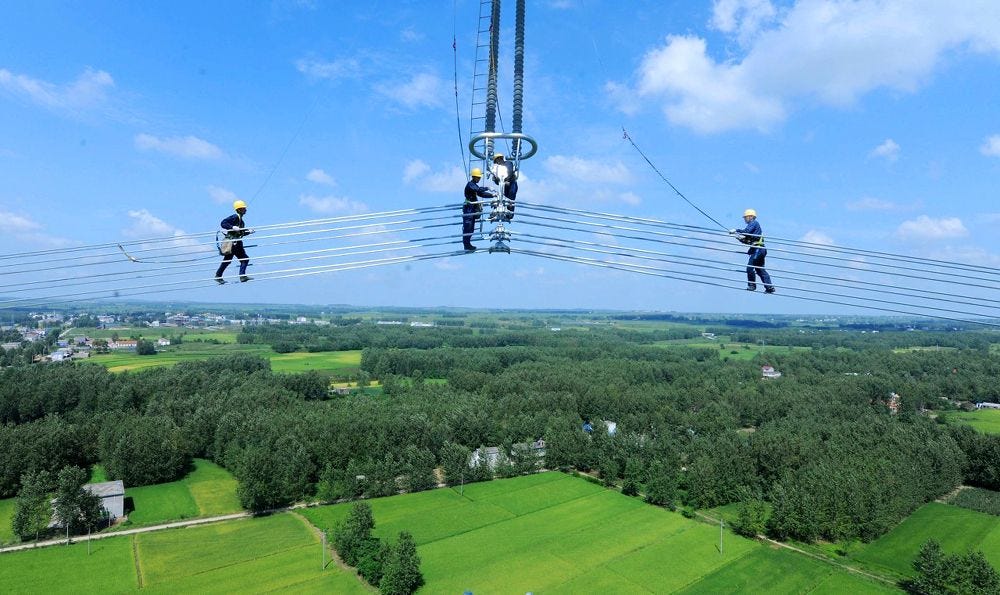 Chinese workers are installing a UHV transmission line between southern  Anhui and Shanghai | Anhui, Transmission line, Shanghai