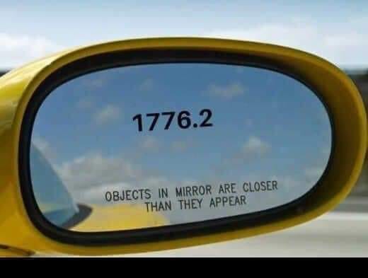 May be an image of rearview mirror, car, road and text that says '1776.2 OBJECTS IN MIRROR ARE CLOSER THAN THEY APPEAR'