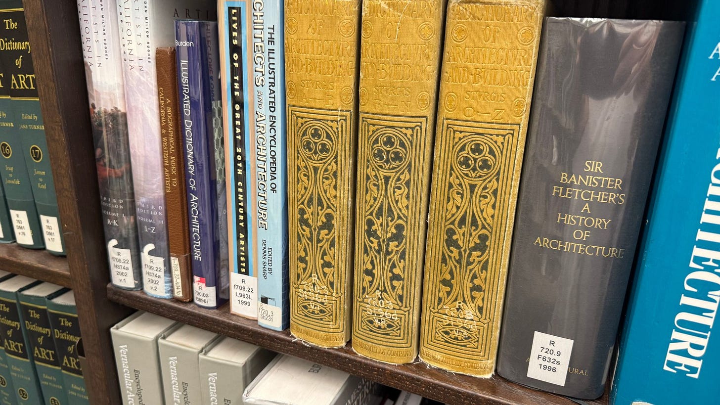 A shelf of old books and new, plastic covered books.