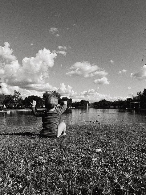 baby boy in nature, with mama, & daddy.