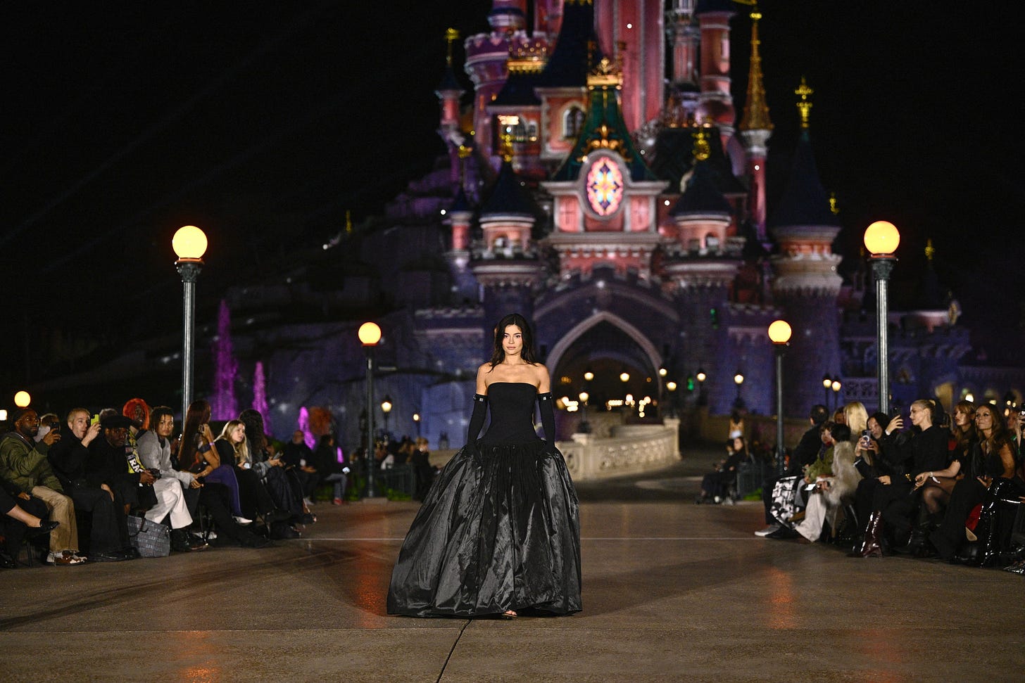 Image may contain Clothing Dress Adult Person Accessories Bag Handbag Amusement Park Fun and Theme Park