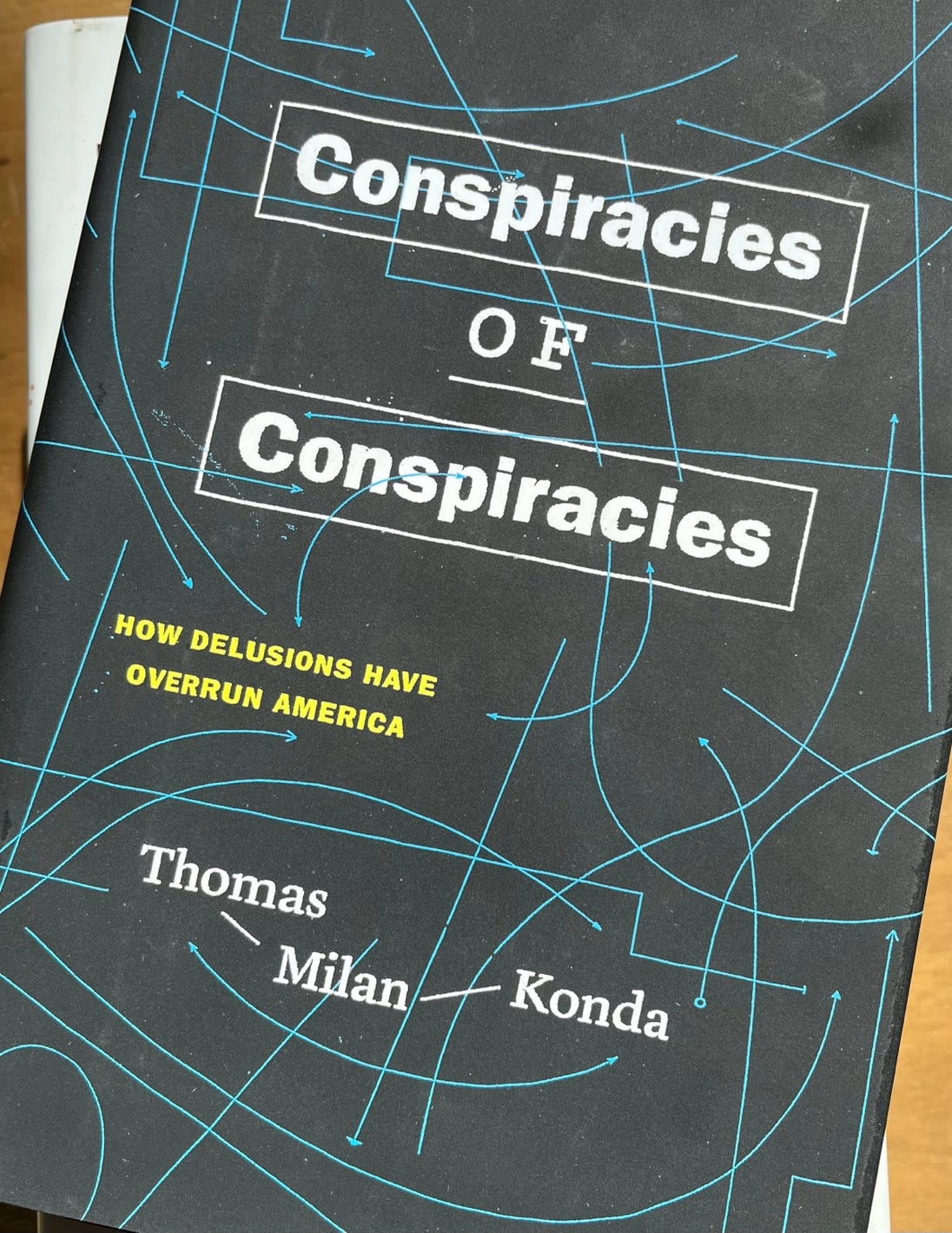 A book cover with white text and blue lines

AI-generated content may be incorrect.