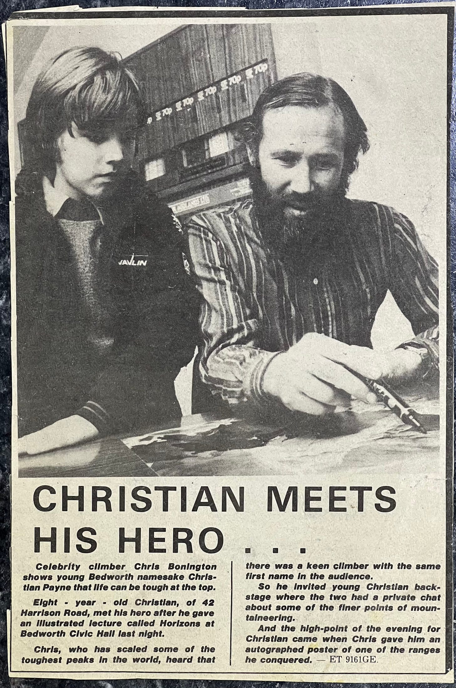 A newspaper clipping of me aged 8 standing with Chris Bonington as he talks me through his Everest route. A newspaper clipping of me aged 8 standing with Chris Bonington as he talks me through his Everest route.