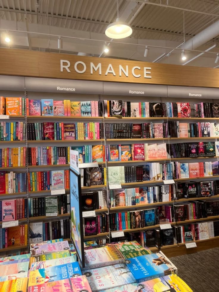 This may contain: there are many books on the shelves in this bookstore