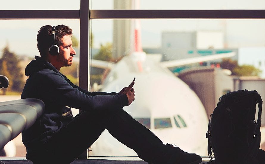 man using wifi at airport unknown hackers man using wifi at airport unknown hackers