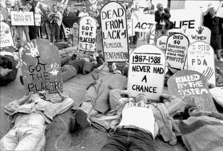 people laying down holding signs people laying down holding signs