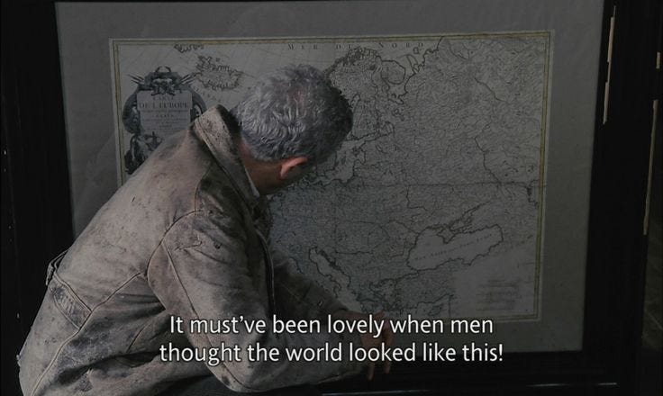 This may contain: a man looking at a map with the words it must't be been lovely when men thought the world looked like this