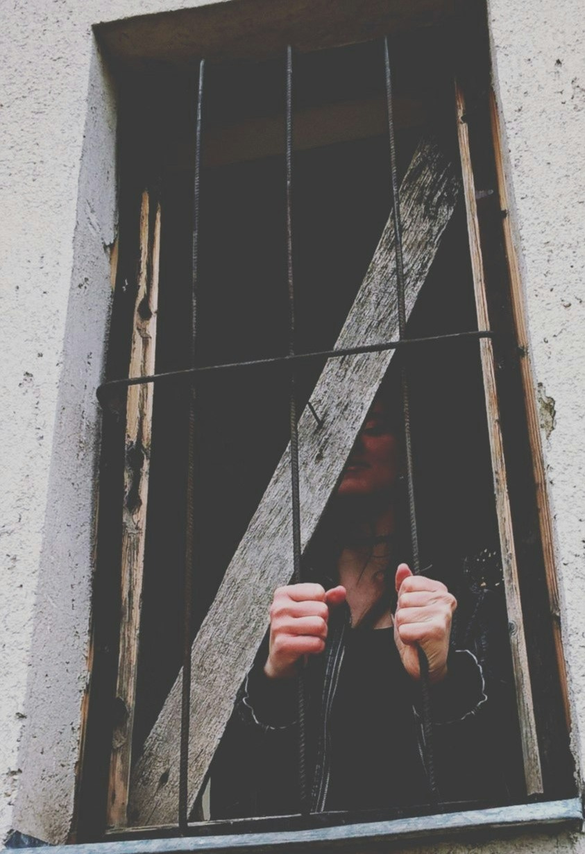 unknown person standing indoors