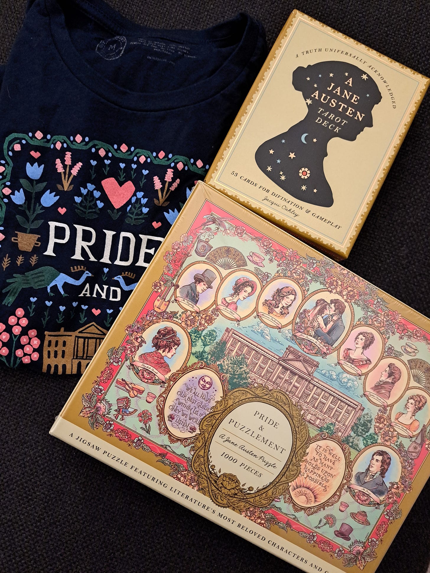 T-shirt that says Pride and Prejudice, a Jane Austen tarot deck, and a Jane Austen puzzle