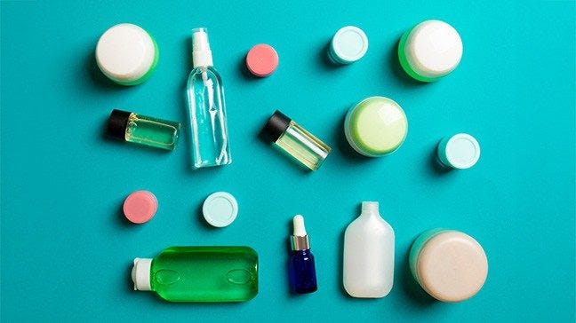 A group of bottles of cosmetics.