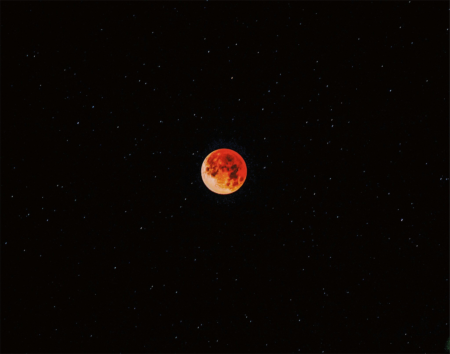 blood moon in a starry night sky blood moon in a starry night sky