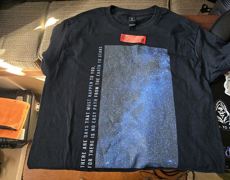 Images of three shirts; Faith over Fear, "I'm tired of being socially experimented on", and "there is no easy path from the Earth to the Stars"