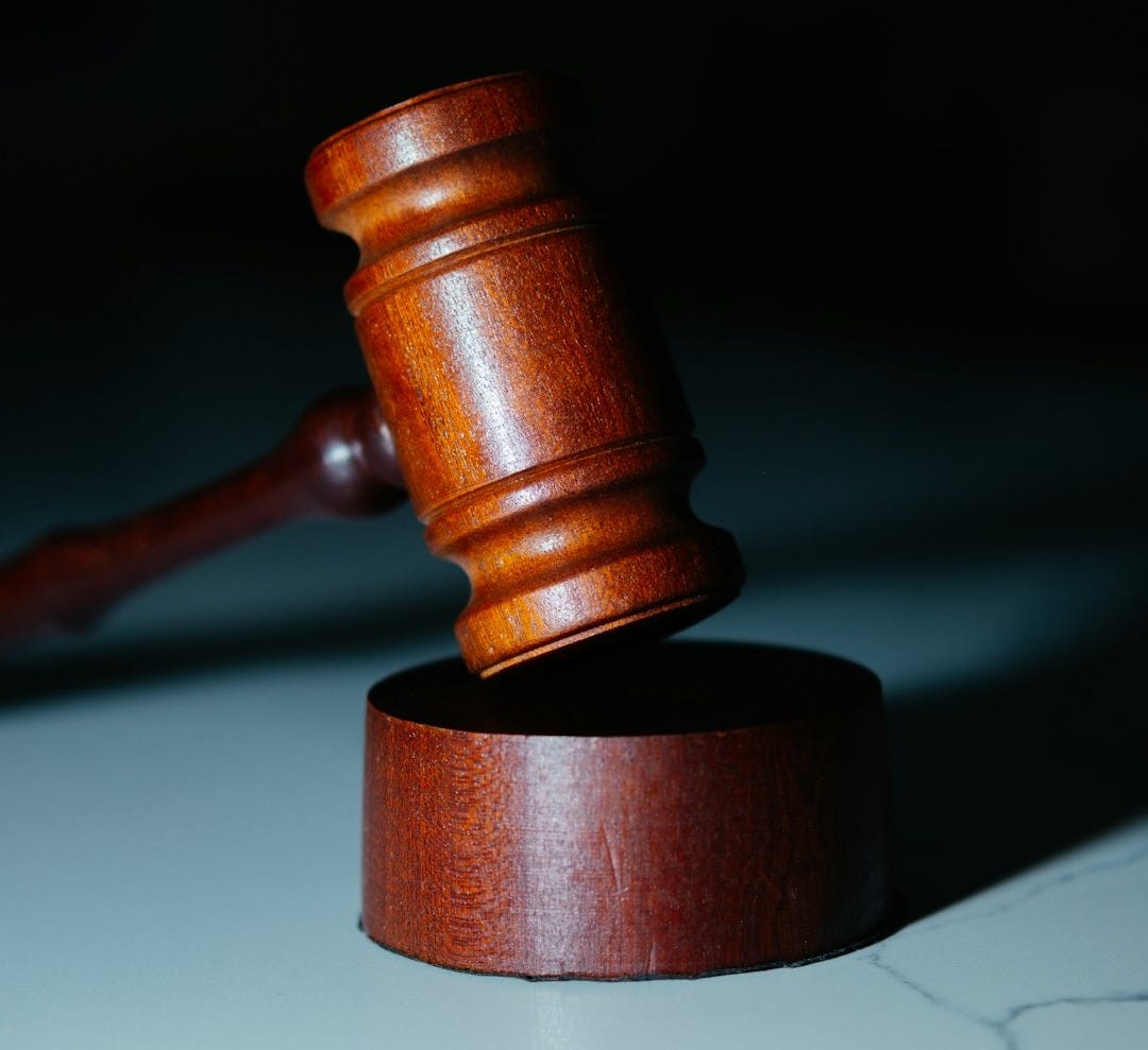 a wooden gaven sitting on top of a white counter a wooden gaven sitting on top of a white counter
